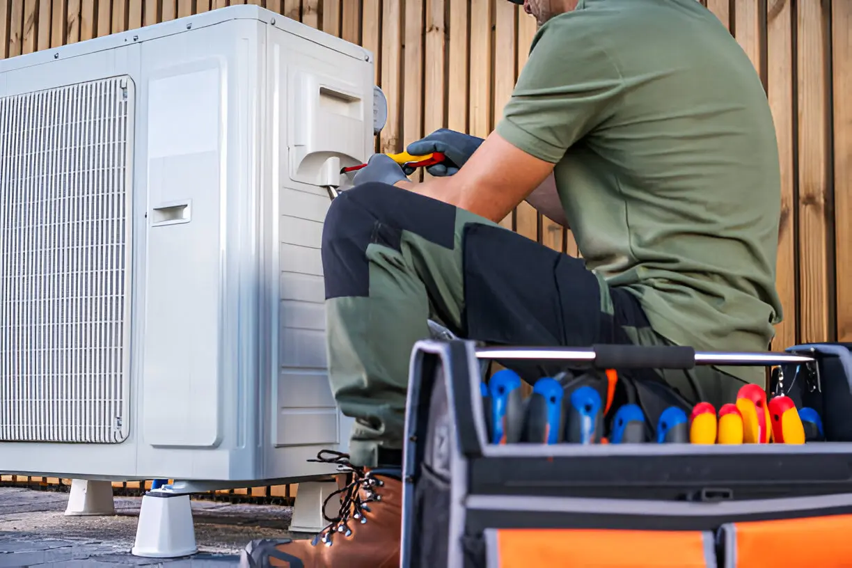 Certified technician repairing a residential air conditioner unit in Los Angeles