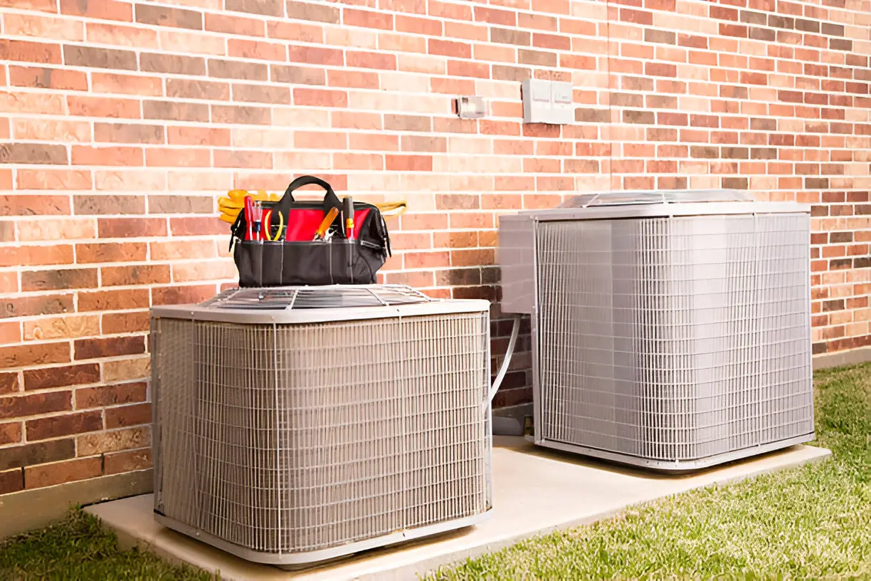 Air conditioning contractor Los Angeles replacing an old AC unit in a suburban house