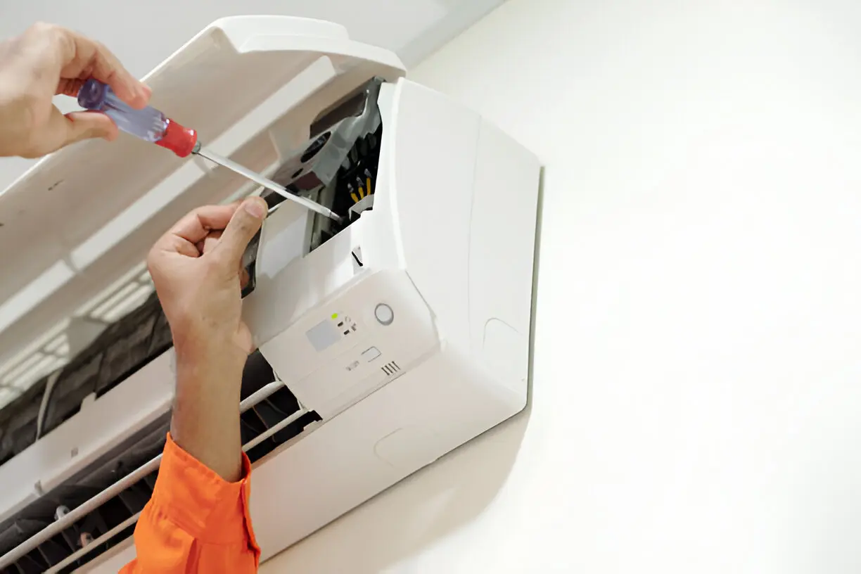 HVAC technician performing late-night emergency AC repair service