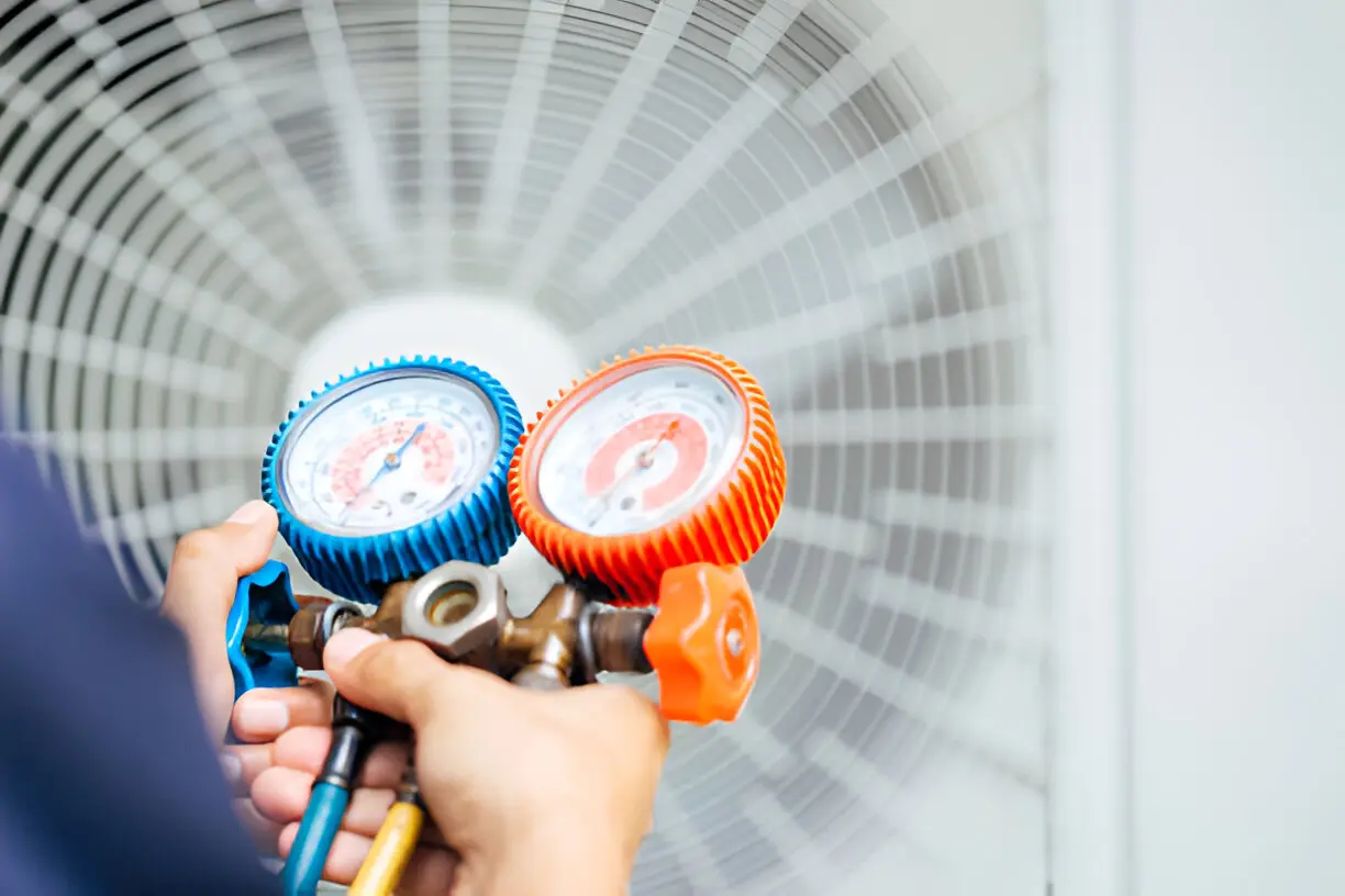 Technician servicing a home heating system during winter in Los Angeles